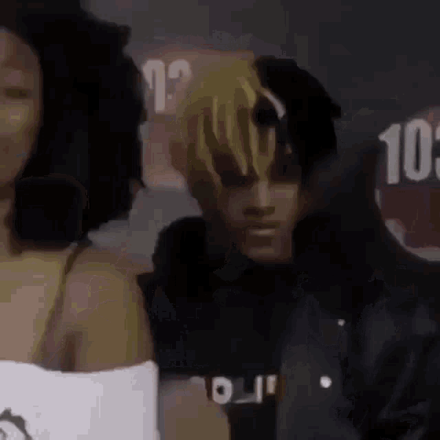 a man and a woman are standing next to each other .