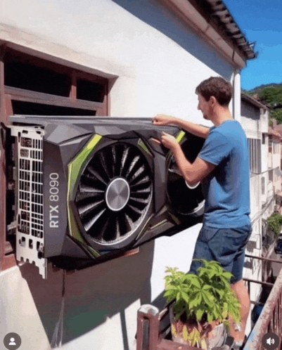 a man is installing a rtx 8090 graphics card