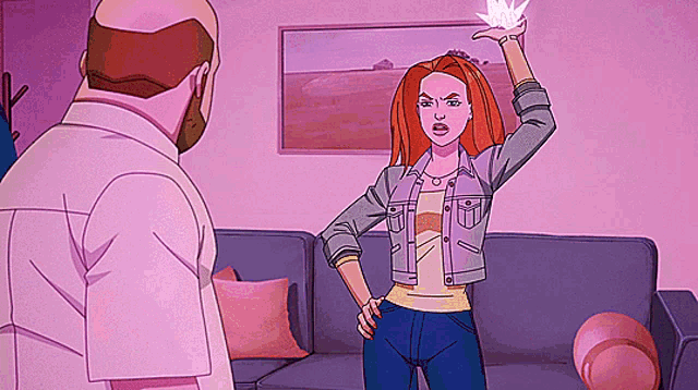 a man and a woman are standing in front of a couch