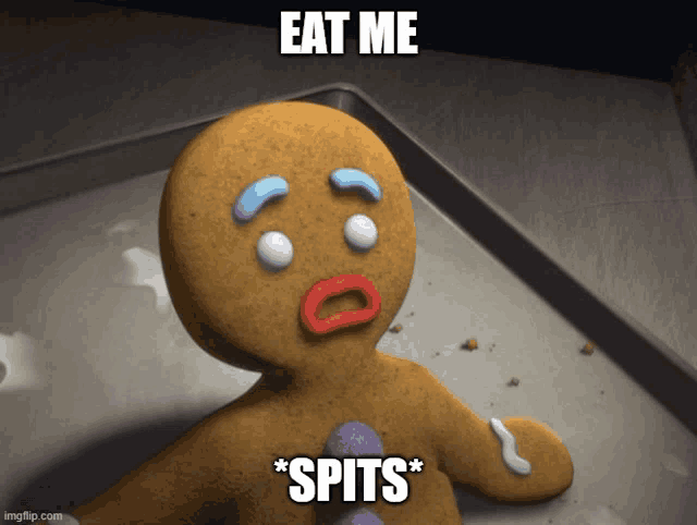 a gingerbread man is laying on a tray with the words eat me * spits * below him