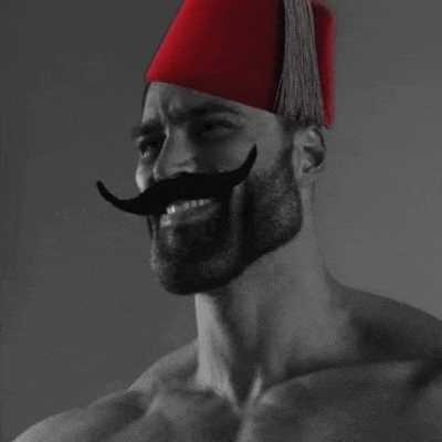 a shirtless man with a beard and mustache is wearing a red hat .