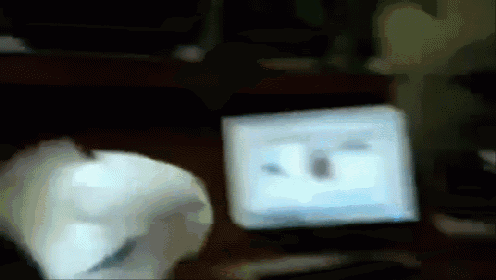 a blurred image of a computer monitor with a few letters on it