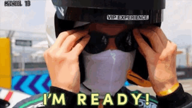 a man wearing a mask and sunglasses is ready to race