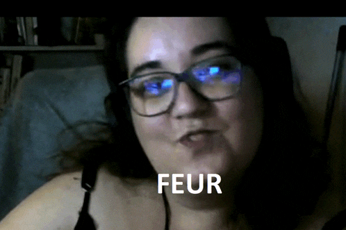 a woman wearing glasses and headphones has the word feur written in front of her