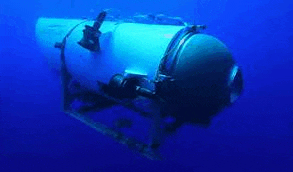 a white submarine is floating in the ocean .