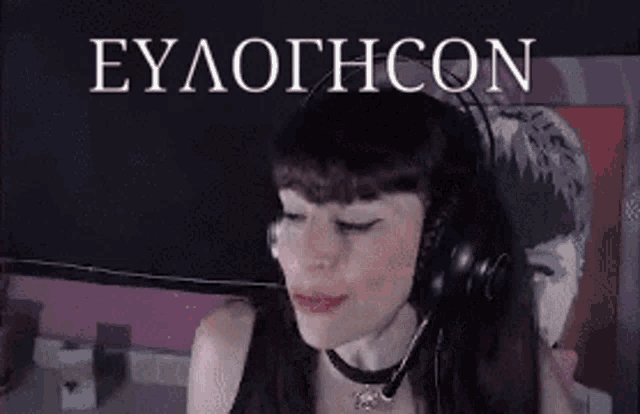 a woman wearing headphones and a microphone with the word eylothcon in white letters behind her