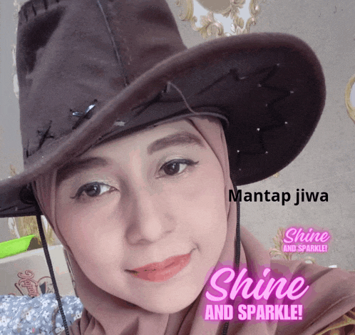 a woman wearing a cowboy hat with mantap jiwa shine and sparkle written in pink