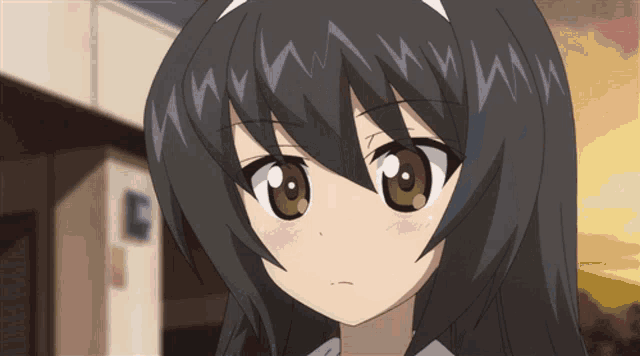 a close up of a girl 's face with a few letters on it