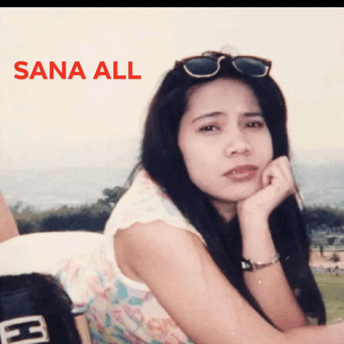 a woman wearing sunglasses sits with her hand on her chin and the words sana all above her