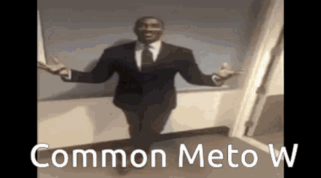 a man in a suit and tie is dancing in a room with the words common meto w on the bottom