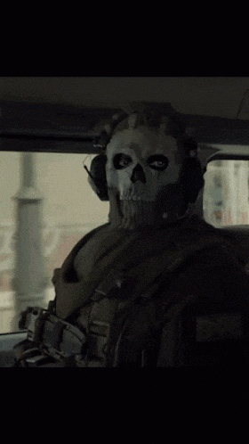 a soldier wearing a skull mask and headphones