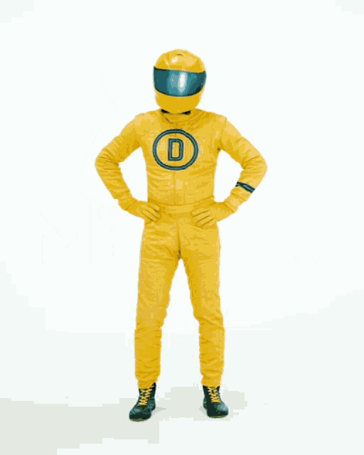 a man in a yellow suit with a helmet on his head is standing with his hands on his hips and the word mhhh above him