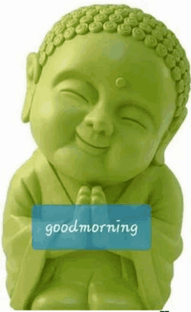 a green statue of a baby buddha with a good morning message on it .