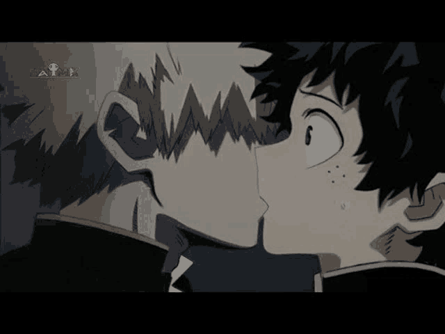 a couple of anime characters kissing each other on the cheek .