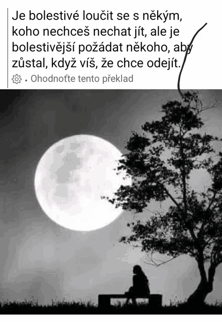 a black and white photo of a person sitting under a tree with a full moon in the background .