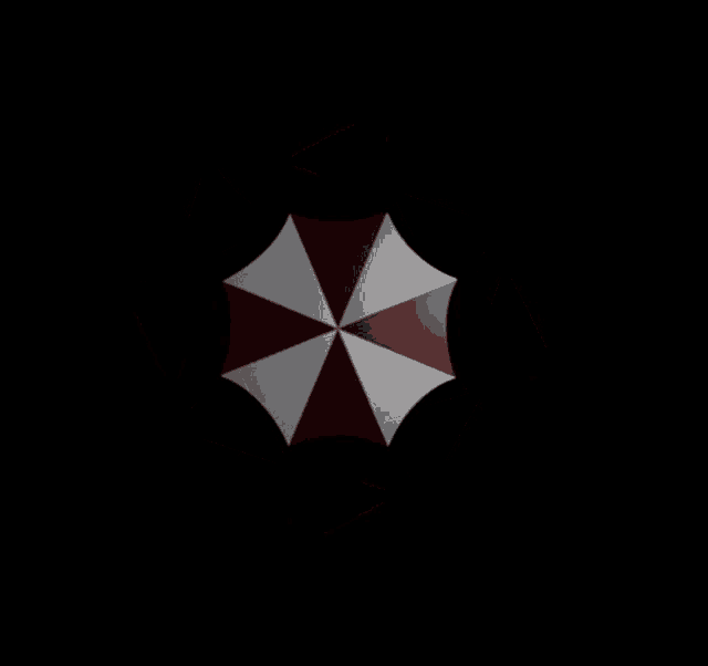 a red and white umbrella is against a black background