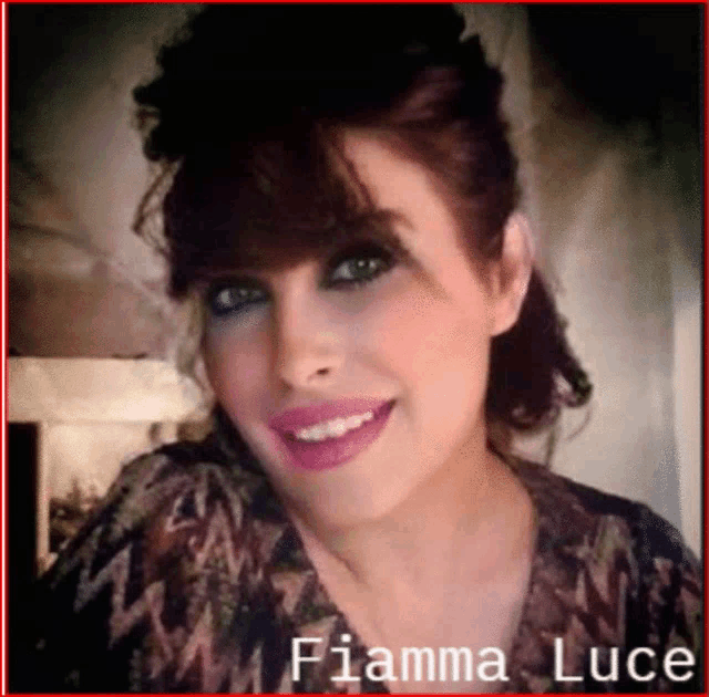 a woman named fiamma luce is smiling in a photo