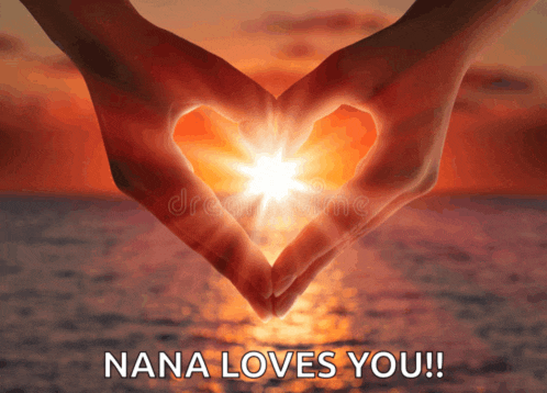 a woman making a heart shape with her hands with the words nana loves you below it