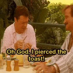 two men are sitting at a table eating food and one of them says oh god i pierced the toast