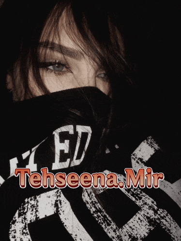 a woman wearing a black shirt with tehseena.mir written on it