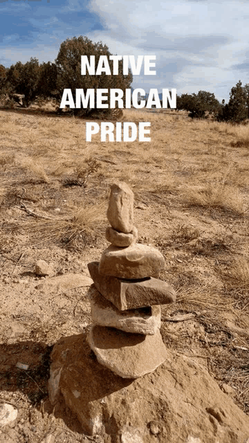 a stack of rocks with native american pride written on the bottom