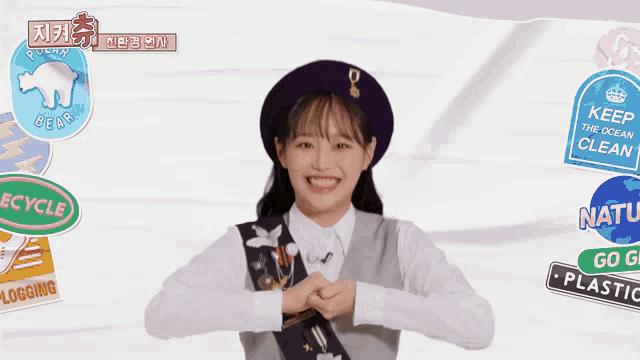 a girl wearing a beret and a badge that says recycle