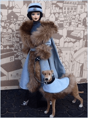 a barbie doll is standing next to a dog wearing a coat .