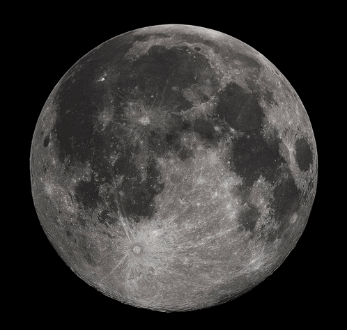 a full moon against a black background with a few spots of light