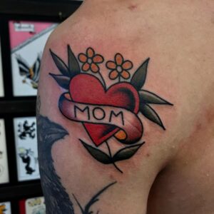 arm tattoos on men with heart and banner