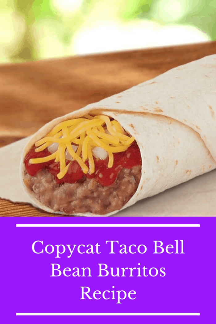 A close-up of a homemade copycat Taco Bell Bean Burrito filled with refried beans, cheese, and red sauce, wrapped in a soft tortilla.