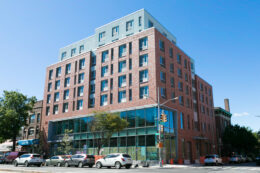 Exterior of the Sunset Park Library and Apartments, via Fifth Avenue Committee