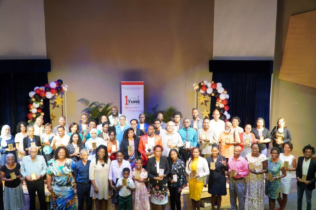 FRONT ROW:  Professor Kenneth Ramchand, fourth from left, is flanked at the left by Jasmin Simmons, director Heritage Library division and on his right by Paula Greene, executive director, Nalis and Beverly Williams, deputy executive director, Nalis. - 