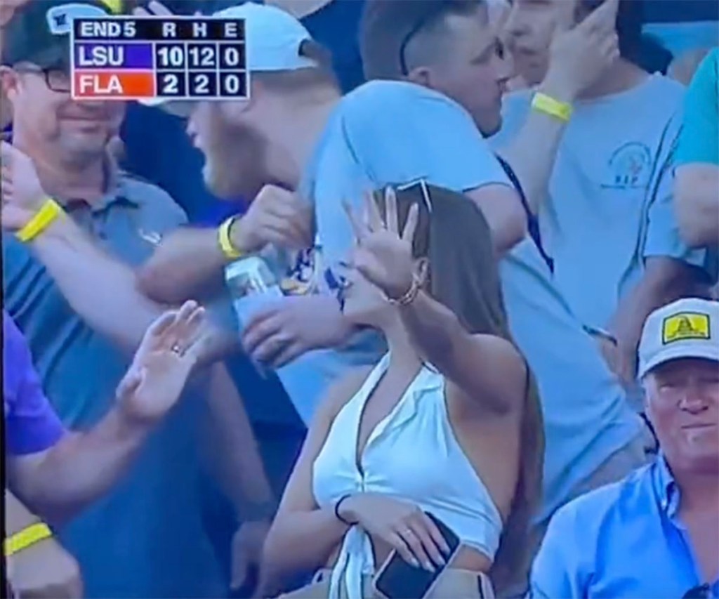 Two fans had an awkward exchange in the stands during LSU's 18-4 victory over Florida on June 26, 2023 to clinch the Men's College World Series crown. 