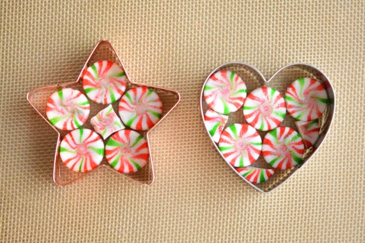 These melted peppermint candy ornaments are ADORABLE and they're super easy to make! Such a fun and inexpensive homemade Christmas ornament idea to make with the kids!