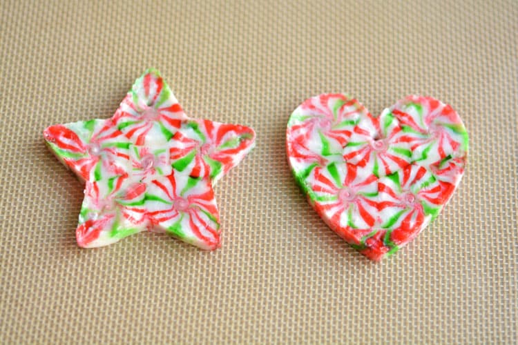 These melted peppermint candy ornaments are ADORABLE and they're super easy to make! Such a fun and inexpensive homemade Christmas ornament idea to make with the kids!