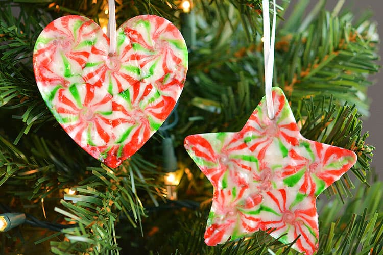 These melted peppermint candy ornaments are ADORABLE and they're super easy to make! Such a fun and inexpensive homemade Christmas ornament idea to make with the kids!