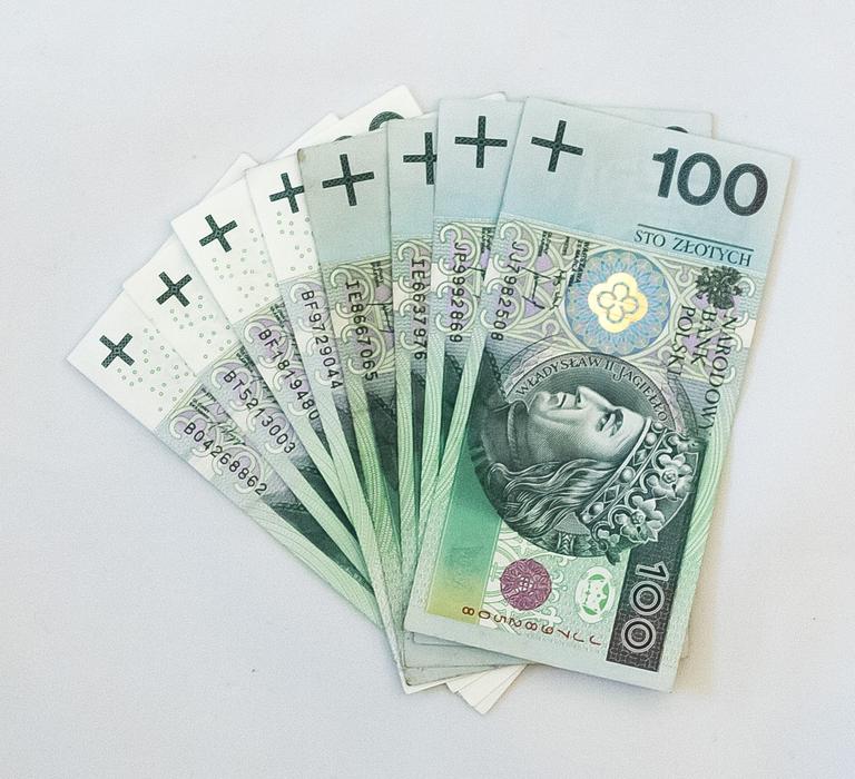 Colorful money banknotes of value of '100', with portraits