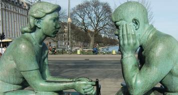 Sculpture Couple Speaking in park