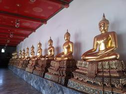 Statues sitting in a Buddha temple