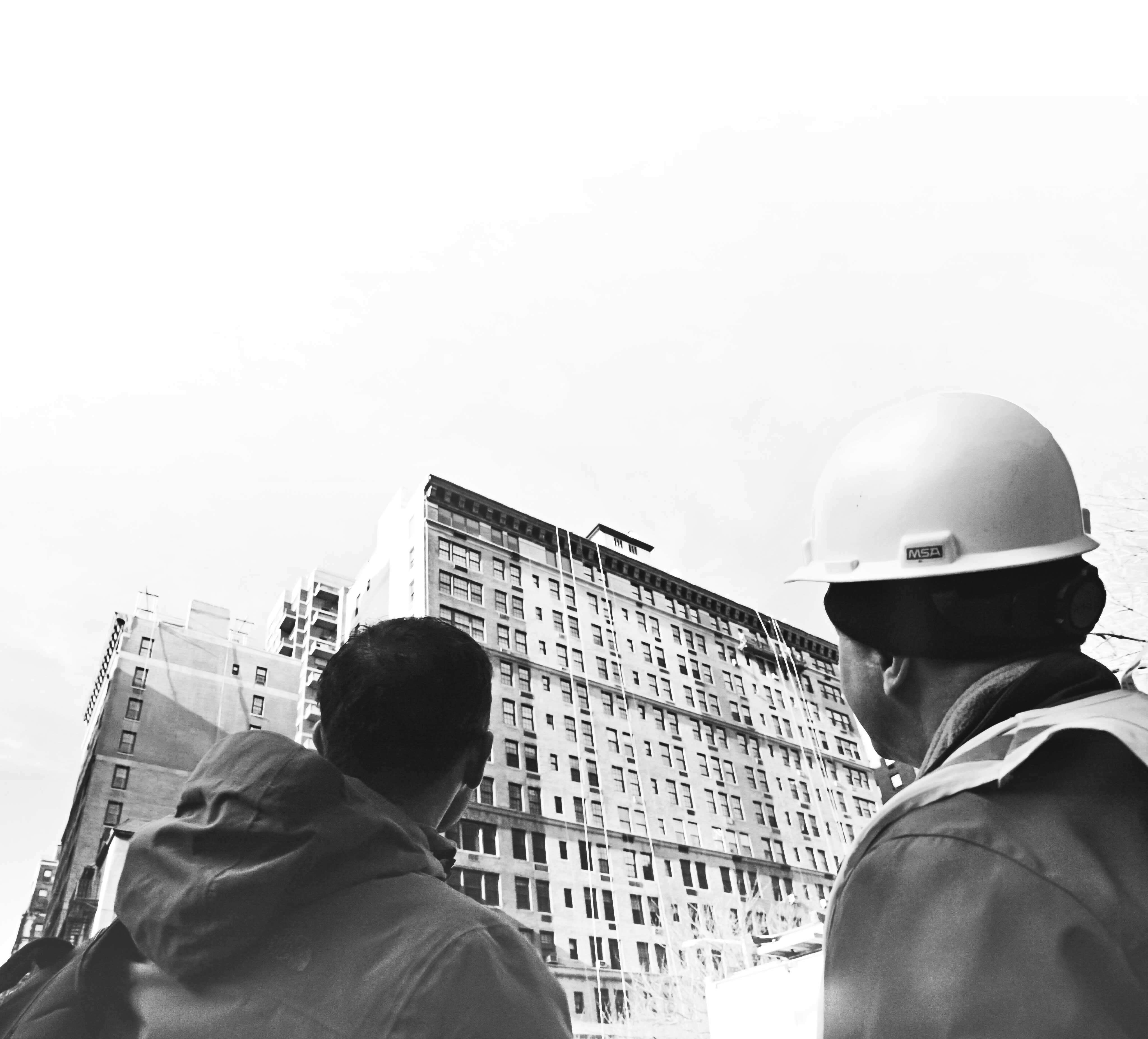 Prosoco workers looking at old building.