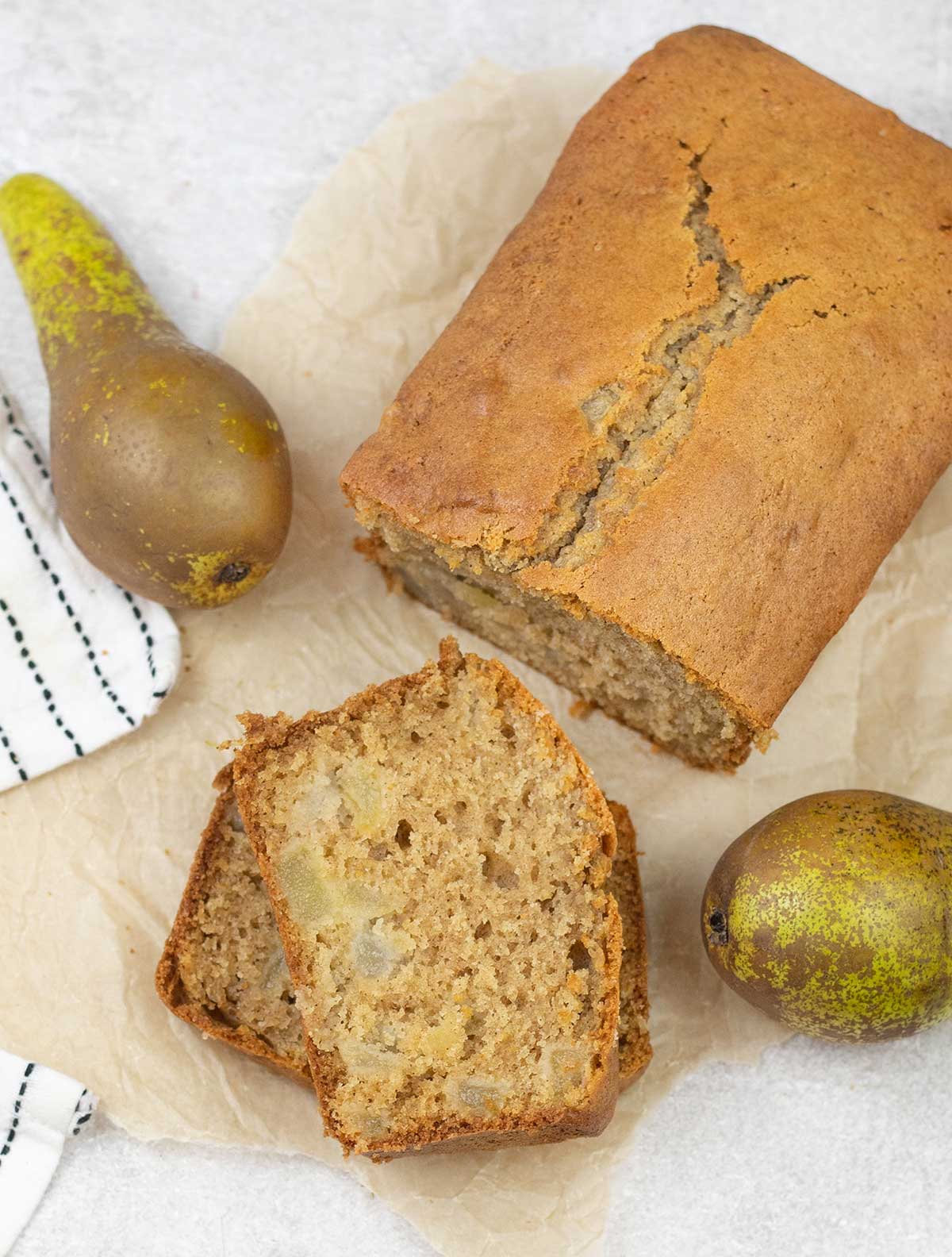 Pear Bread along with some pears around it.