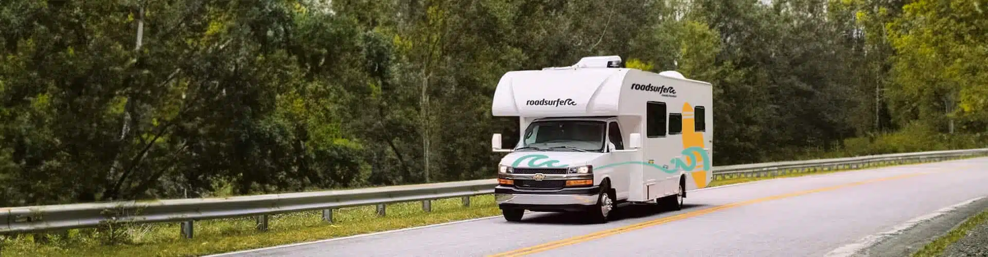 Family Freedom Class C RV driving down the road