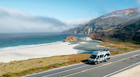 Motorhome on a road along the coastline