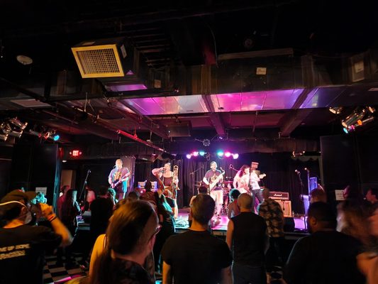 Photo of Black Cat - Washington, DC, DC, US. a group of people on stage