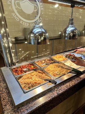 Photo of King Buffet - Reno, NV, US. a man serving food to a woman