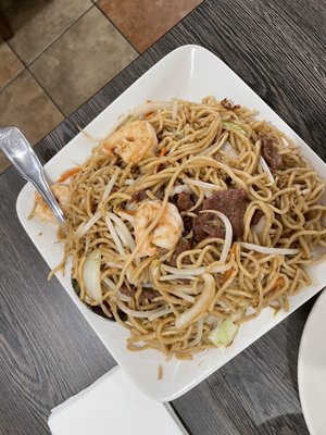 Photo of New China Restaurant - Delano, CA, US. a plate of noodles with meat and shrimp