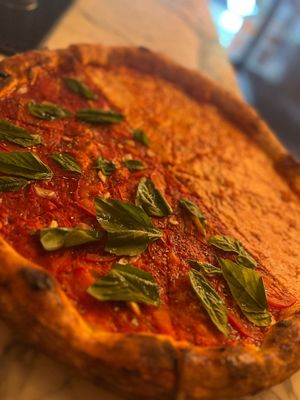 Photo of Grand Street Pizza - New York, NY, US. Half OG cheese, Half Tomato & Basil