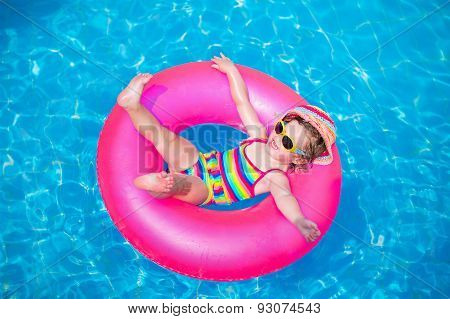 Cute Little Girl Playing In Swimming Pool