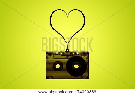 A cassette tape with a heart made of tape coming out of it.