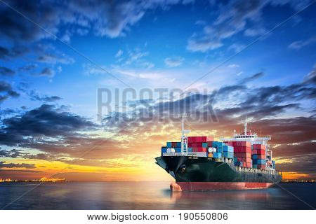 Logistics and transportation of International Container Cargo ship in the ocean at twilight sky Freight Transportation Shipping